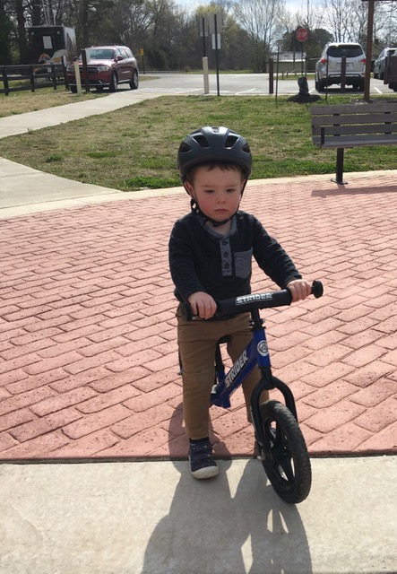 Little boy on his balance bike.